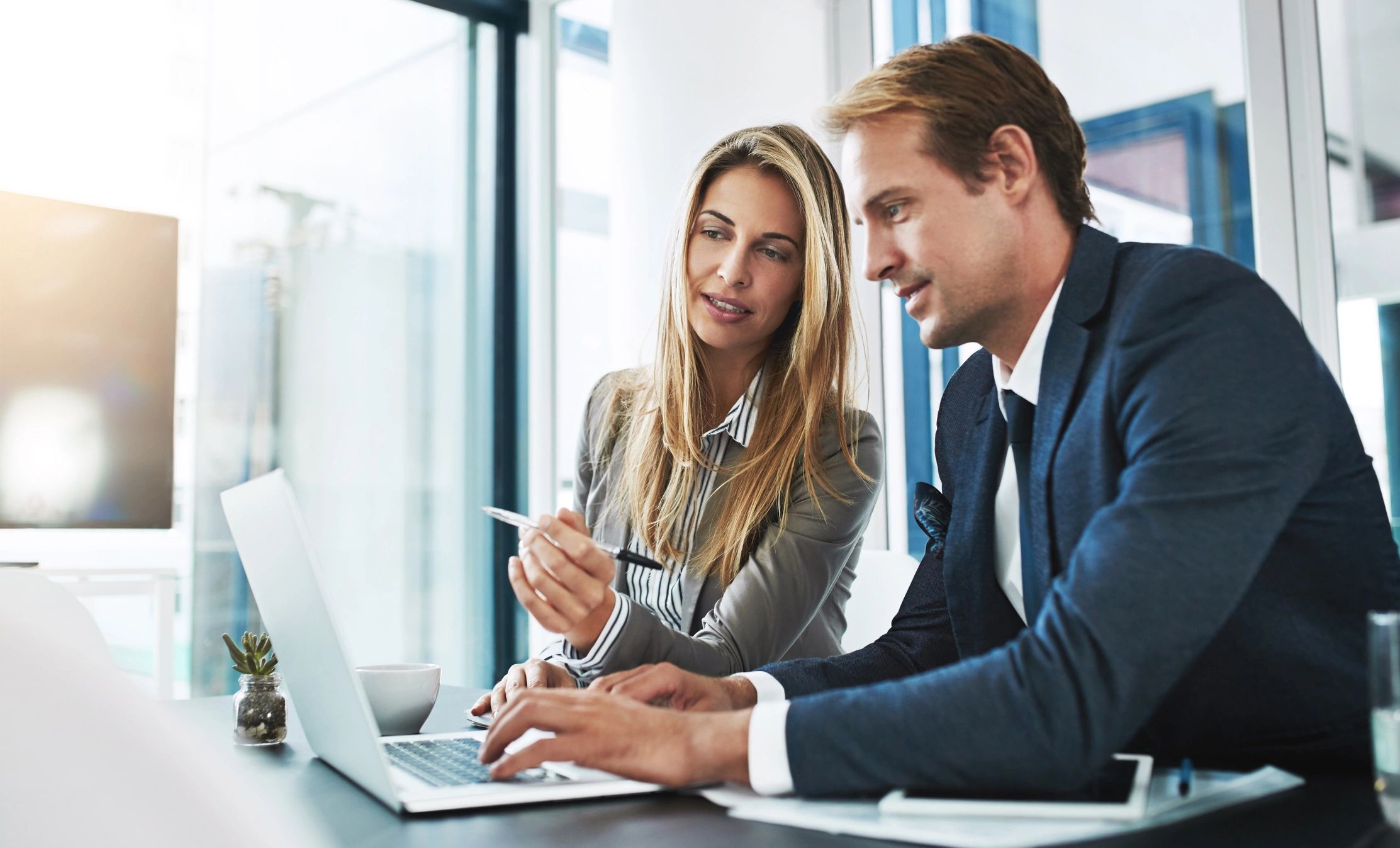 Healthcare professionals discussing HIPAA compliance with IT advisor